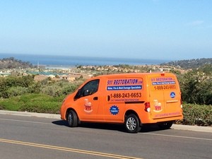 Water Damage Restoration Van Driving To Job Location