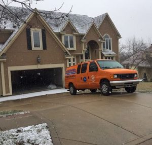 Water Damage And Mold Repair Team At Residential Property